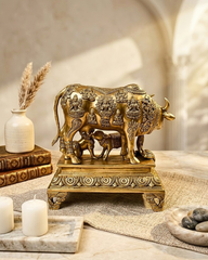 Brass cow with little krishna