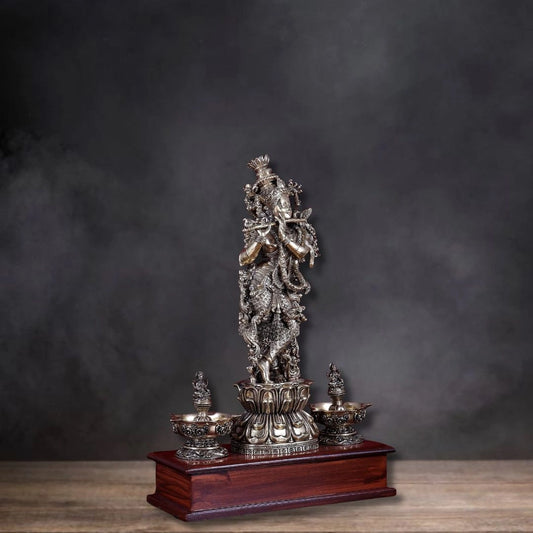 Brass Superfine Lord Krishna Idol with Twin Lakshmi Diyas on Wooden Base